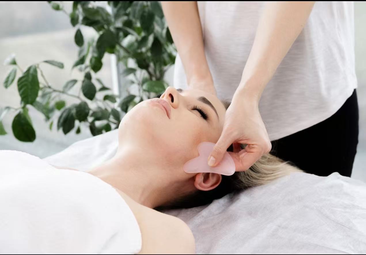 A rose quartz gua sha facial treatment worked along the facial meridians at TAO Therapeutic Massage Spa in Vienna, VA